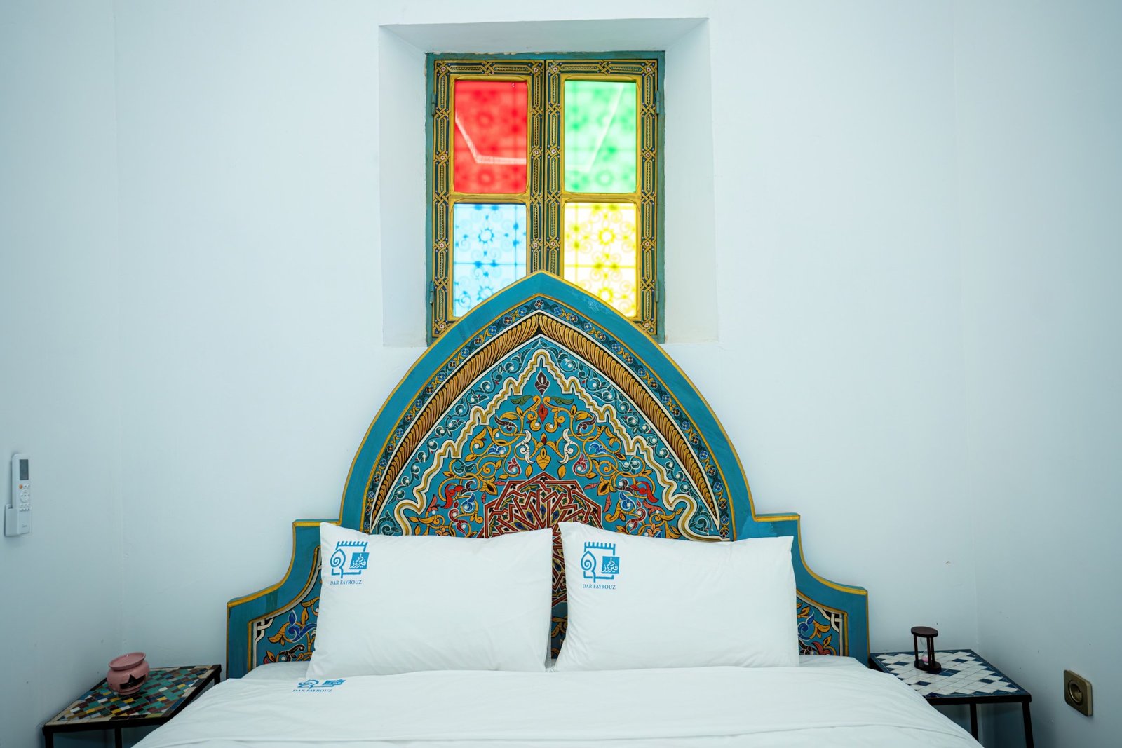 Lalla Yamna room, the bed and stained-glass window